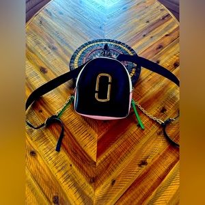 This is an authentic MARC JACOBS Snapshot Backpack in Multicolor.